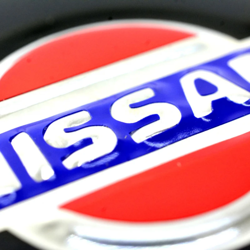 Juego De 4 Tapones Centrales Con Emblema De Nissan Para Rines De Aluminio - Imagen 9